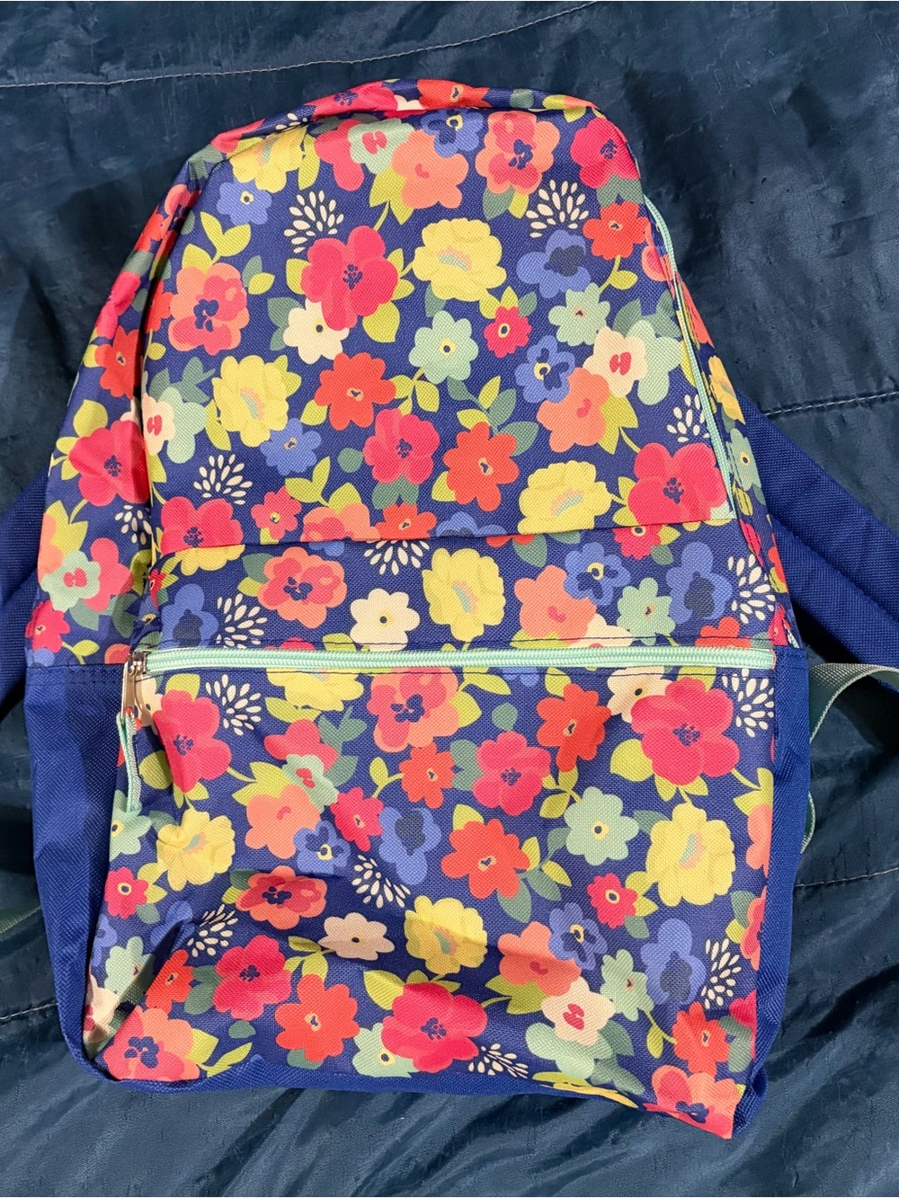 Navy backpack with vibrant flower print